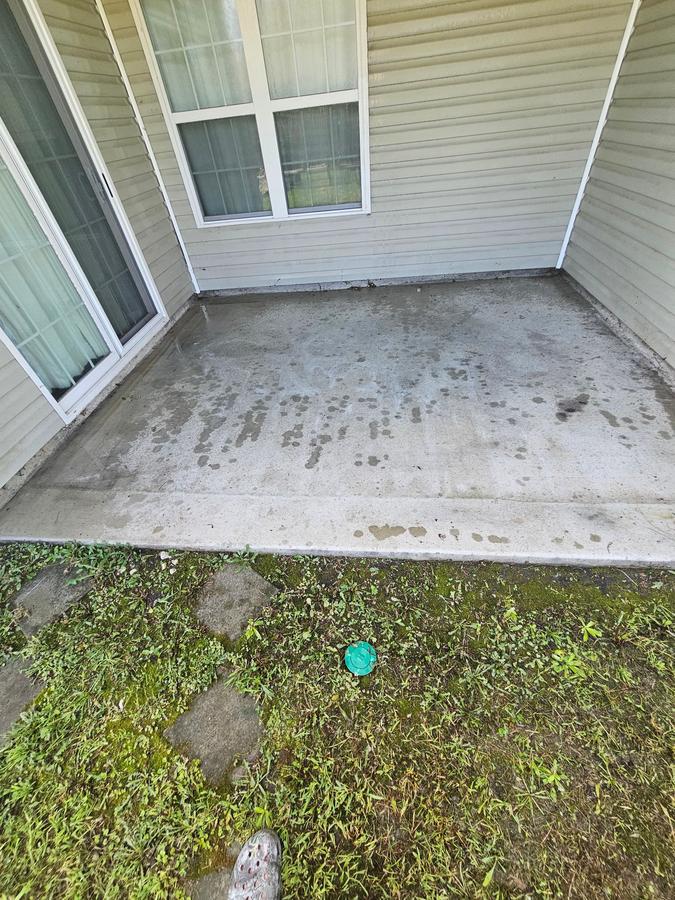 Concrete patio before pressure washing