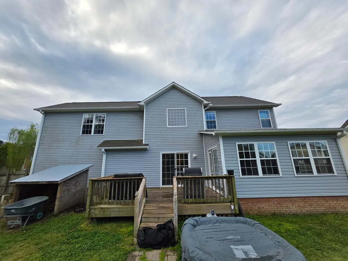 After: blue vinyl siding home fully restored with soft wash treatment by Fresh Start Surface Solutions