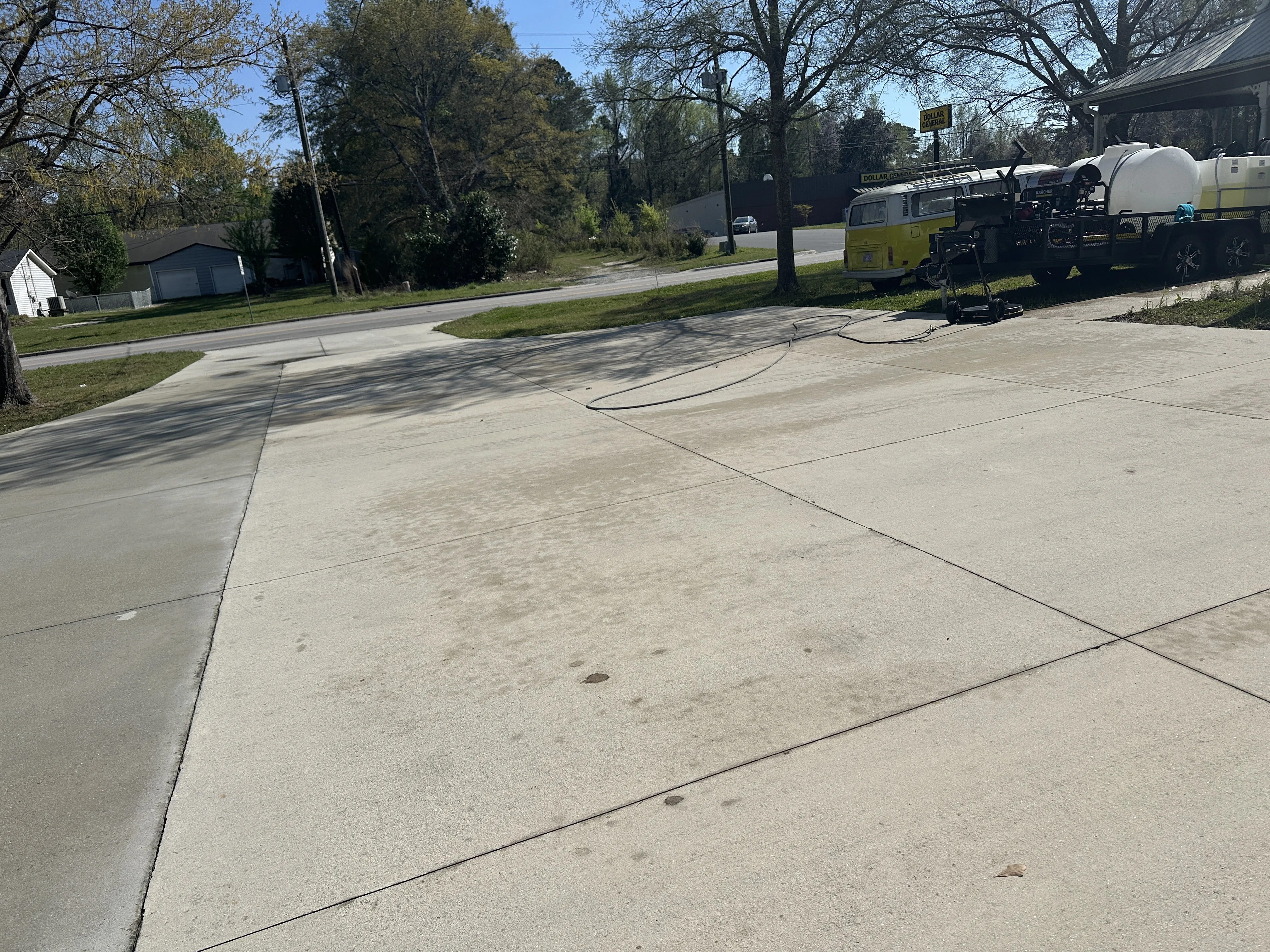 Concrete driveway fully cleaned and restored by Fresh Start Surface Solutions