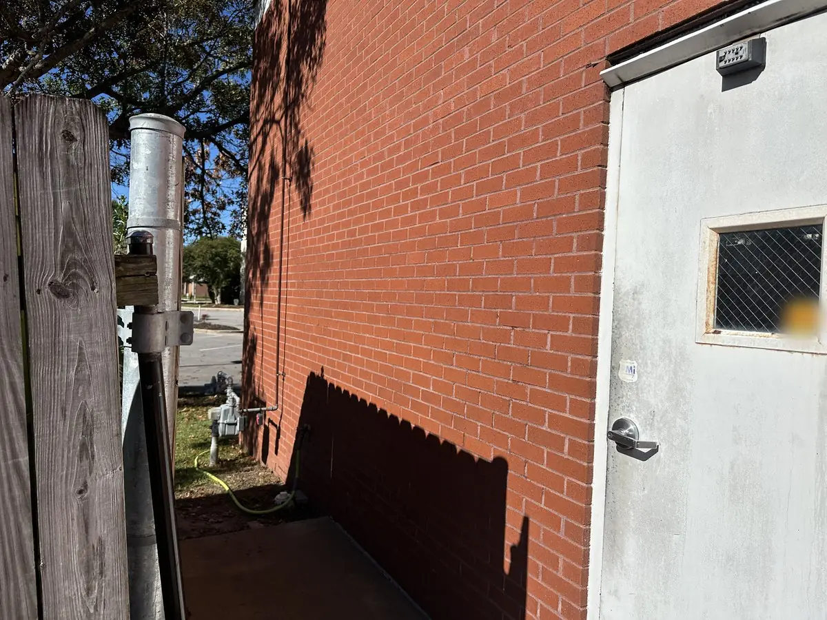 After: the same brick wall with the graffiti removed by Fresh Start Surface Solutions in New Bern, NC