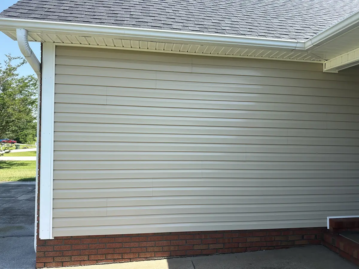 After: white vinyl siding oxidation removed and original color restored by Fresh Start Surface Solutions in Jacksonville, NC