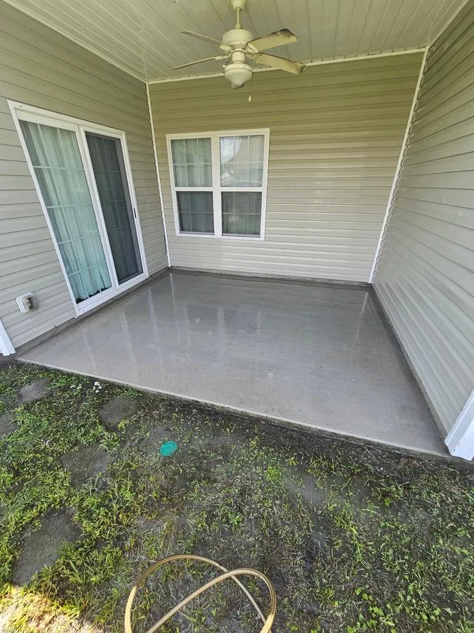 After: concrete back porch pressure washed clean