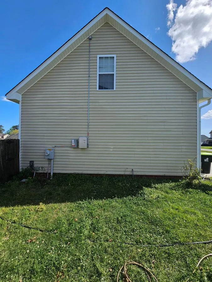 After: side wall cleaned, algae removed, siding restored