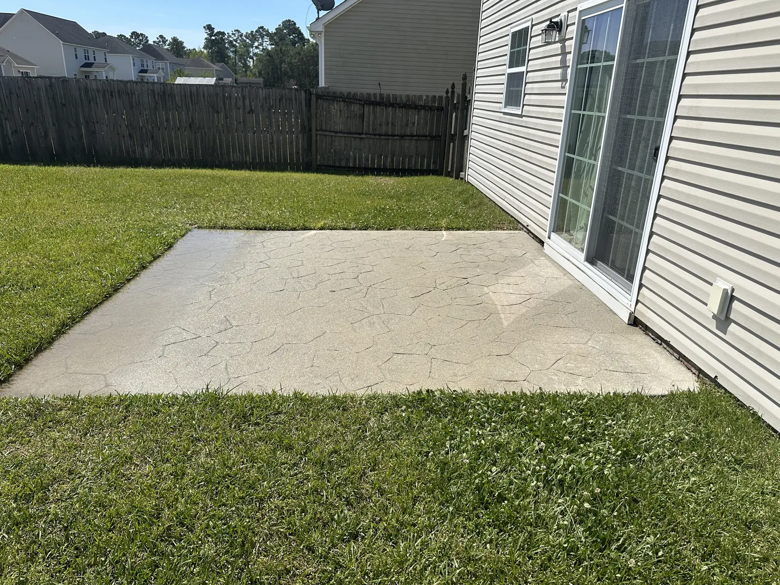 After: stamped concrete patio fully restored and cleaned by pressure washing in Jacksonville NC