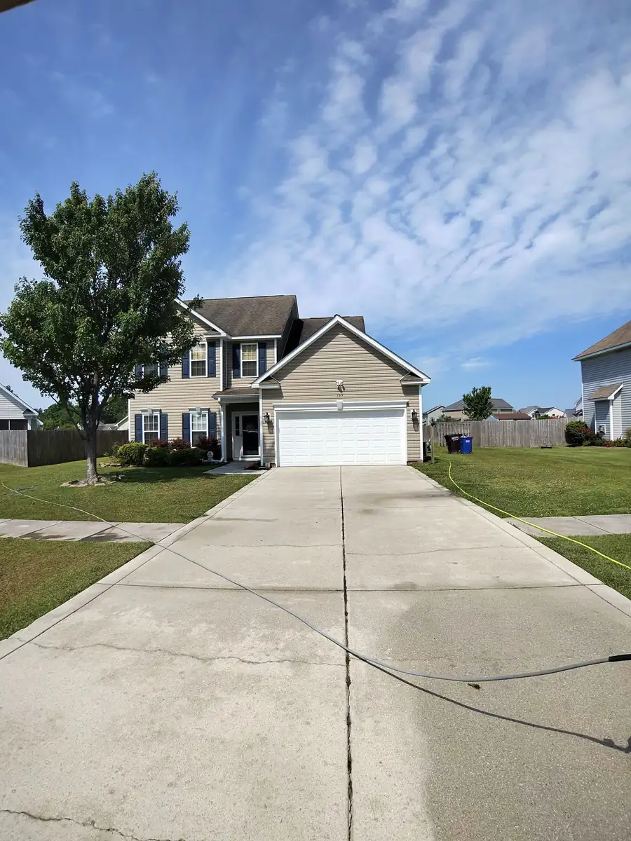 After: two-story home driveway fully cleaned and restored by Fresh Start Surface Solutions