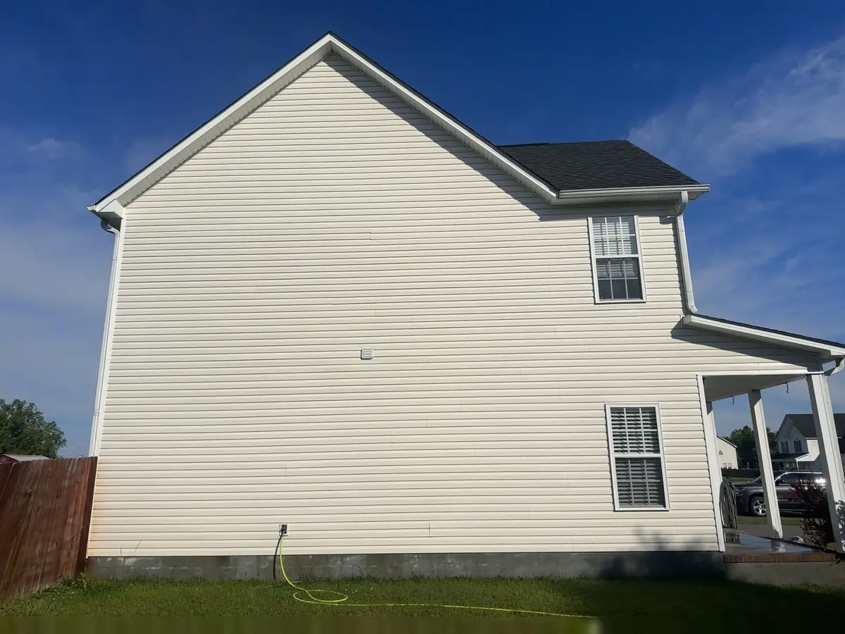 After: white colonial home side fully cleaned by Fresh Start Surface Solutions soft wash
