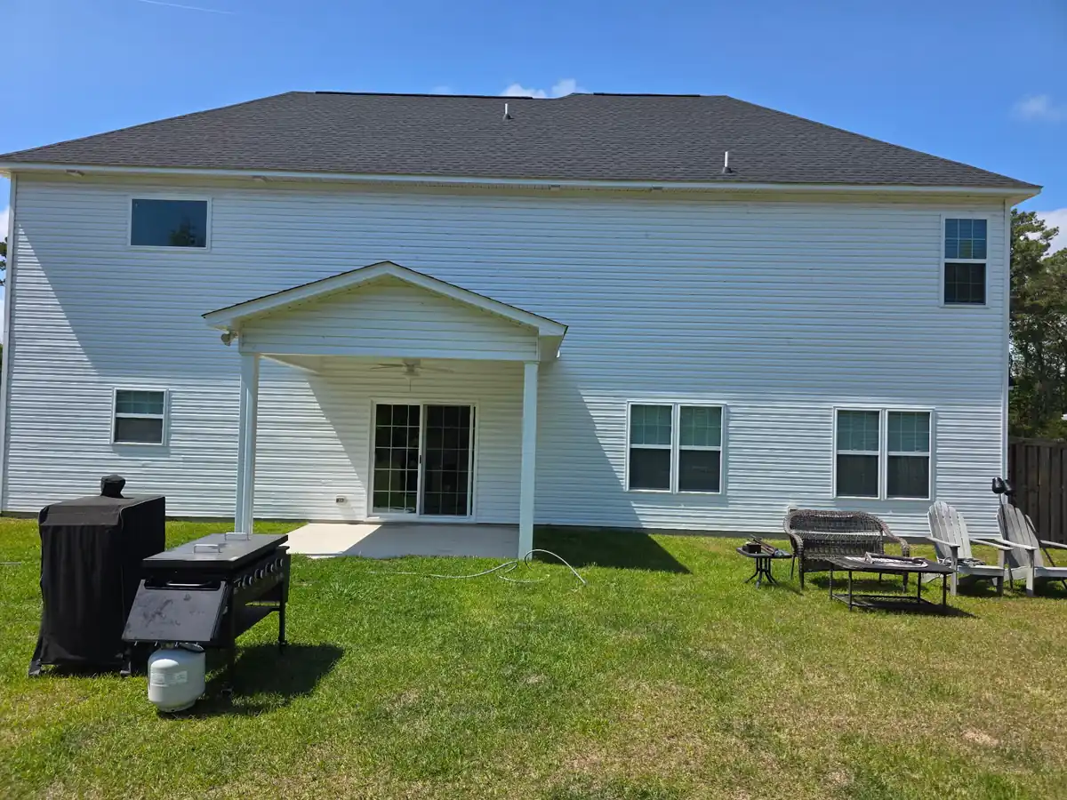 White two-story home fully cleaned by Fresh Start house washing in Jacksonville NC