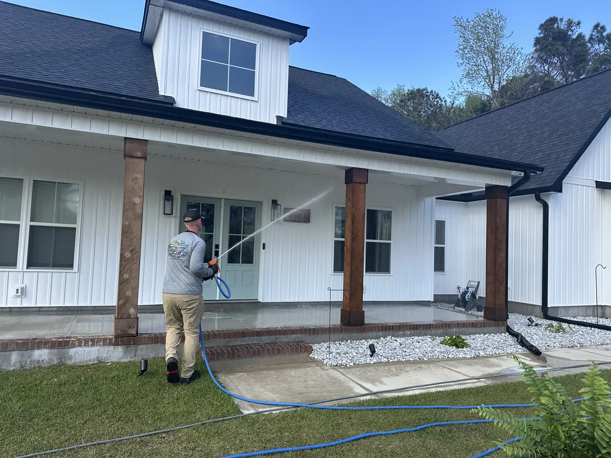 Fresh Start Surface Solutions softwashing a farmhouse front porch, Camp Lejeune service area