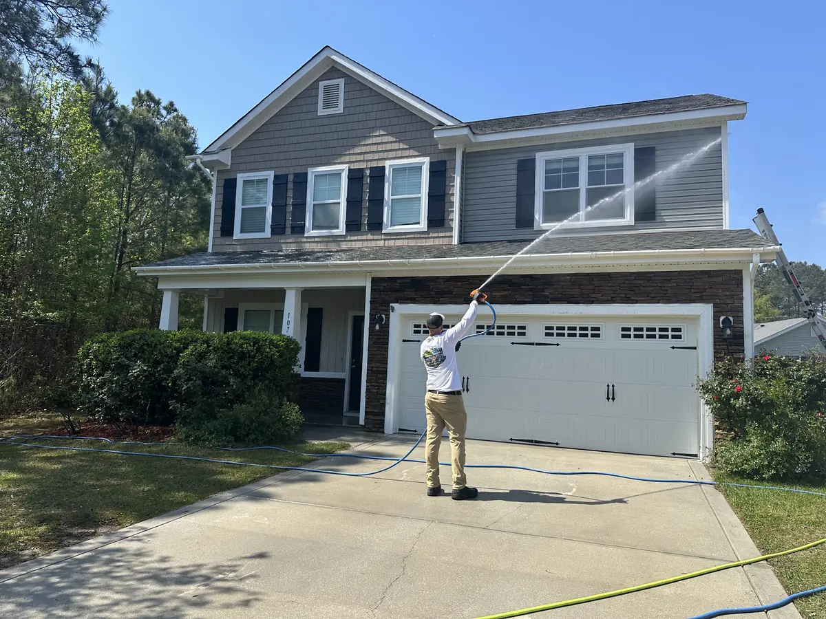 Soft wash in progress on a brick-front home in North Topsail Beach, NC