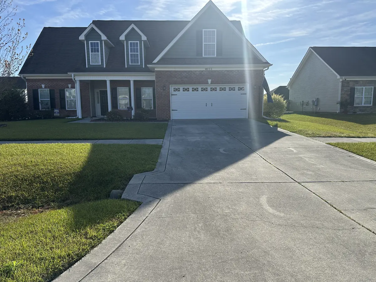 Mixed brick and vinyl home in Piney Green, NC, before pressure washing